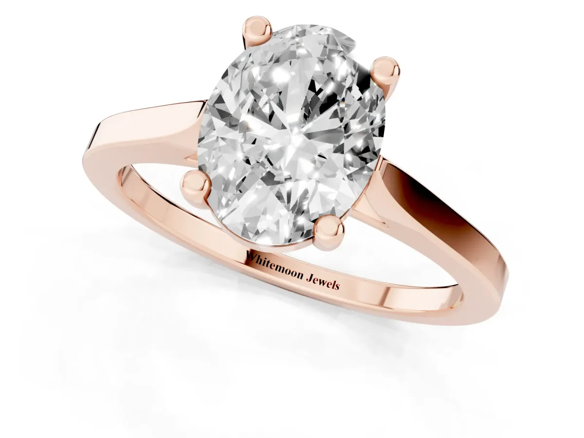 Oval Cut Solitaire Diamond Ring with Four-Prong Setting and Tapered Band Rose gold