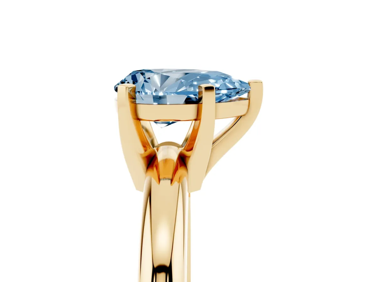 Fancy Blue Pear Cut Diamond Solitaire Engagement Ring with Round Band and Four-Prong Setting Yellow gold