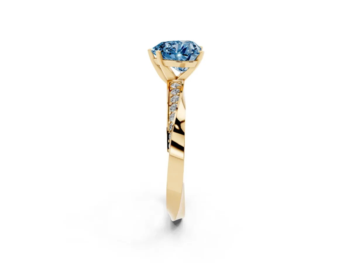 Fancy Blue Heart Cut Diamond Engagement Ring with Side Stone Accents and Four-Prong Setting Yellow gold