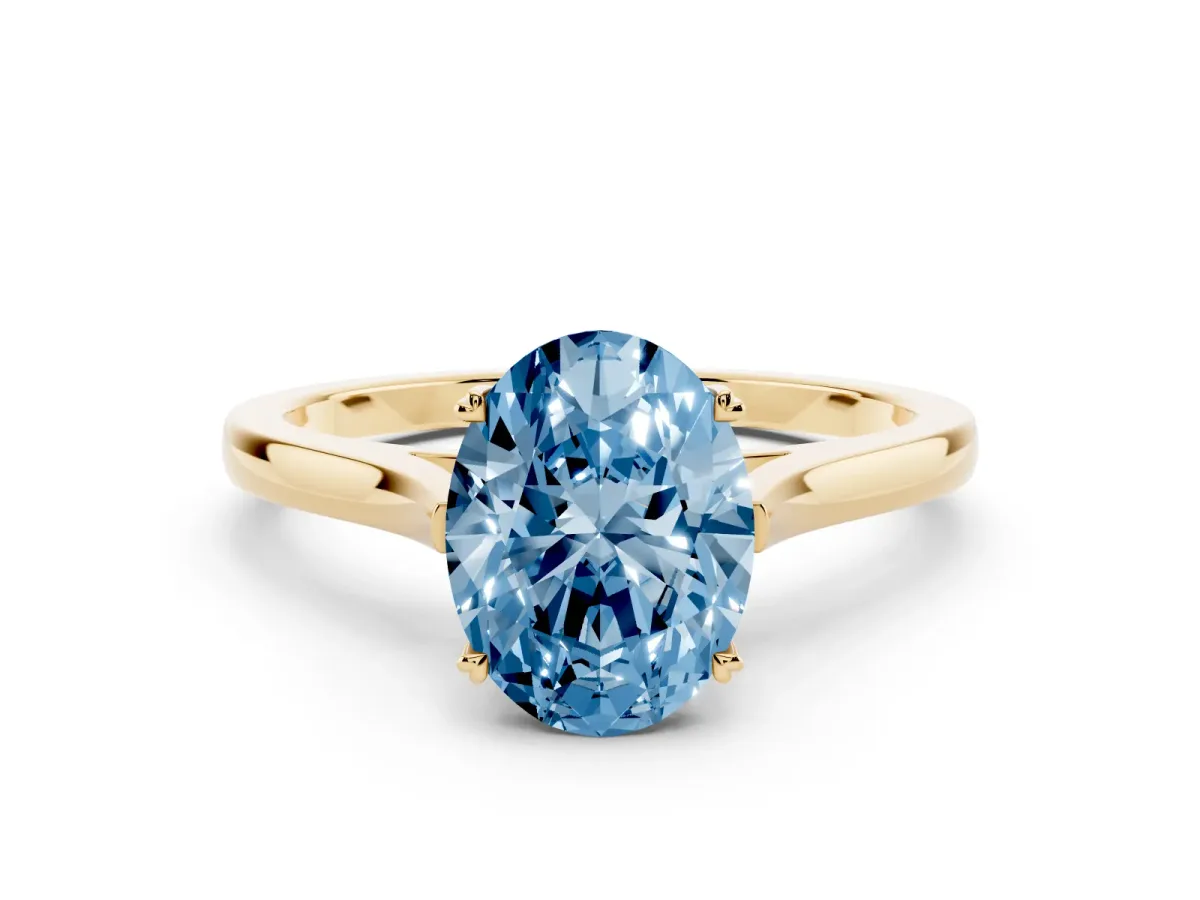 Fancy Blue Oval Cut Solitaire Heart Prong Engagement Ring with Tapered Band Yellow gold