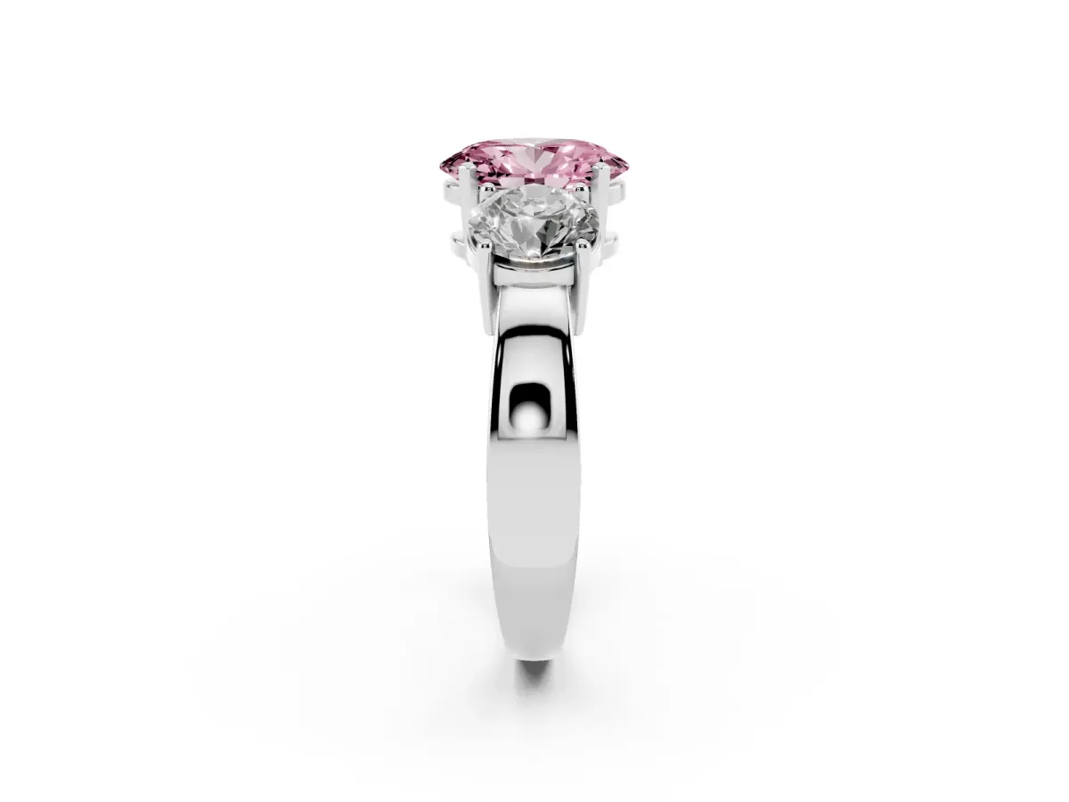 Fancy Pink Three-Stone Oval Cut Diamond Ring with Round Side Stones, Classic Band, and Four-Prong Setting Silver