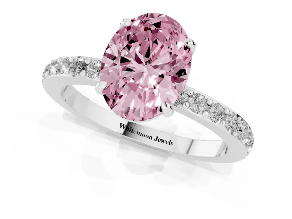 Fancy Pink Oval Cut Diamond Pavé Engagement Ring with Round Accents and Prong Setting Platinum