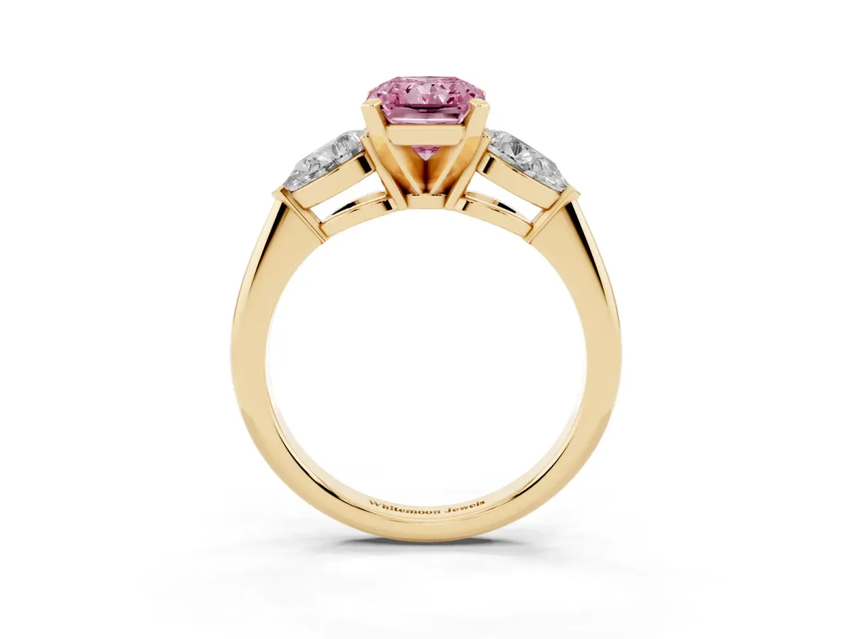 Fancy Pink Three-Stone Radiant Cut Diamond Ring with Pear Side Stones and Four-Prong Setting Yellow gold