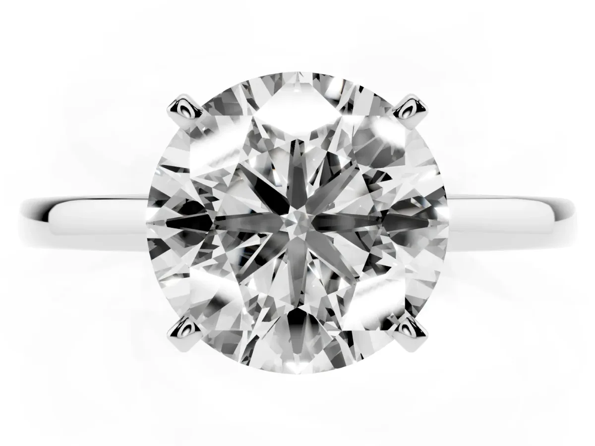 Round Cut Solitaire Diamond Engagement Ring with Four-Prong Setting on a Classic Band Silver