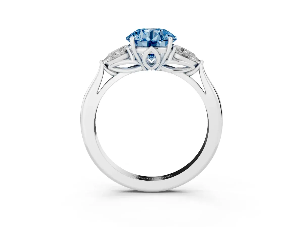 Fancy Blue Three-Stone Round Cut Brilliant Diamond Solitaire Ring with Tapered Band and Four-Prong Setting Platinum