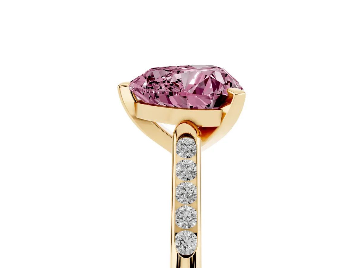 Fancy Pink Heart Cut Diamond Solitaire Ring with Channel Set Round Band and Prong Setting Yellow gold