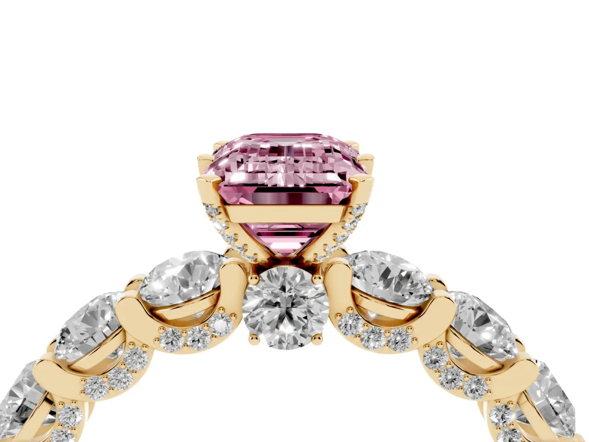 Fancy Pink Emerald Cut Diamond Side Stone Engagement Ring with Four-Prong Setting Yellow gold