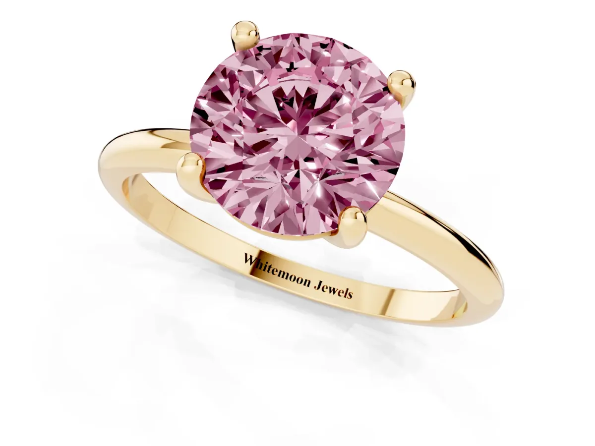 Fancy Pink Round Cut Solitaire Diamond Ring with 4-Prong Setting on a Classic Band Yellow gold
