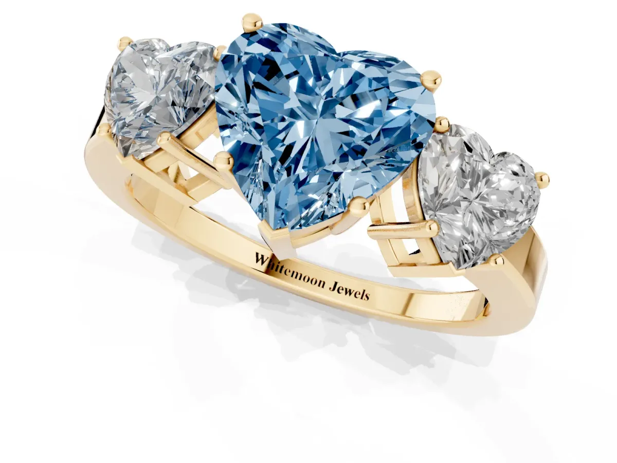 Fancy Blue Three-Stone Heart Cut Cut Diamond Engagement Ring with Flat Band and Four-Prong Setting Yellow gold