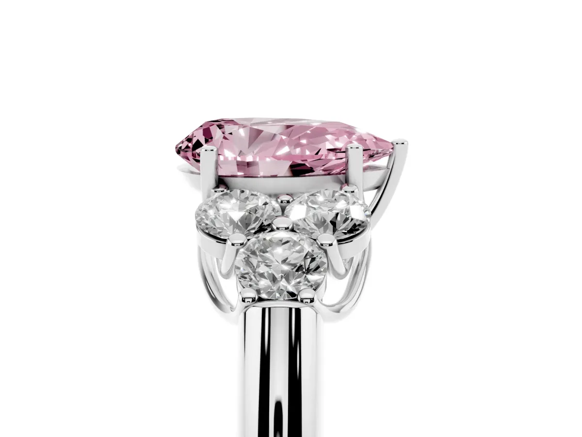 Fancy Pink Pear Cut Cut Diamond Cluster Ring with Round Accent Stones and Prong Setting on a Classic Band White gold
