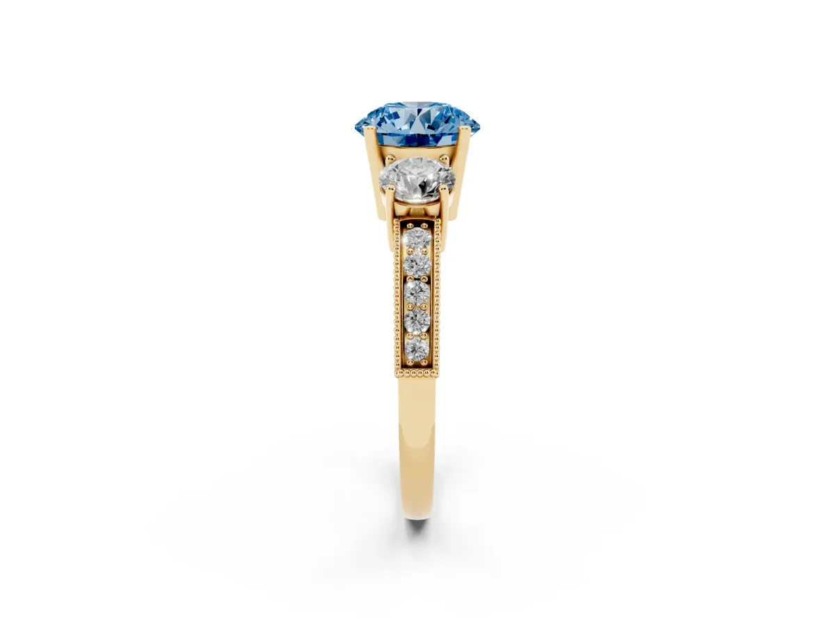Fancy Blue Round Cut Three-Stone Diamond Ring with Pavé Band and Four-Prong Setting Yellow gold