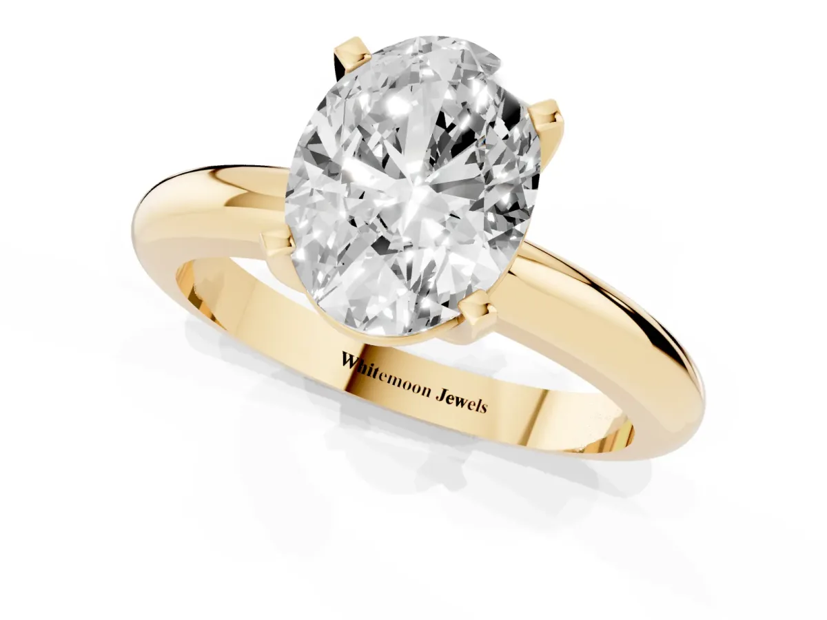 Oval Cut Diamond Solitaire Engagement Ring with Round Band and Four-Prong Setting Yellow gold