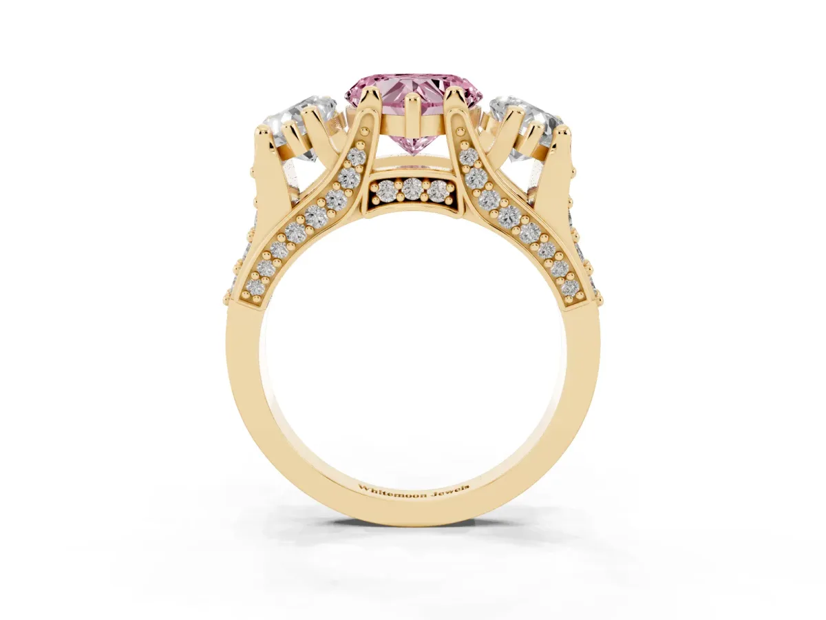 Fancy Pink Heart Cut Diamond Three-Stone Ring with Channel Set Band and Four-Prong Setting Yellow gold