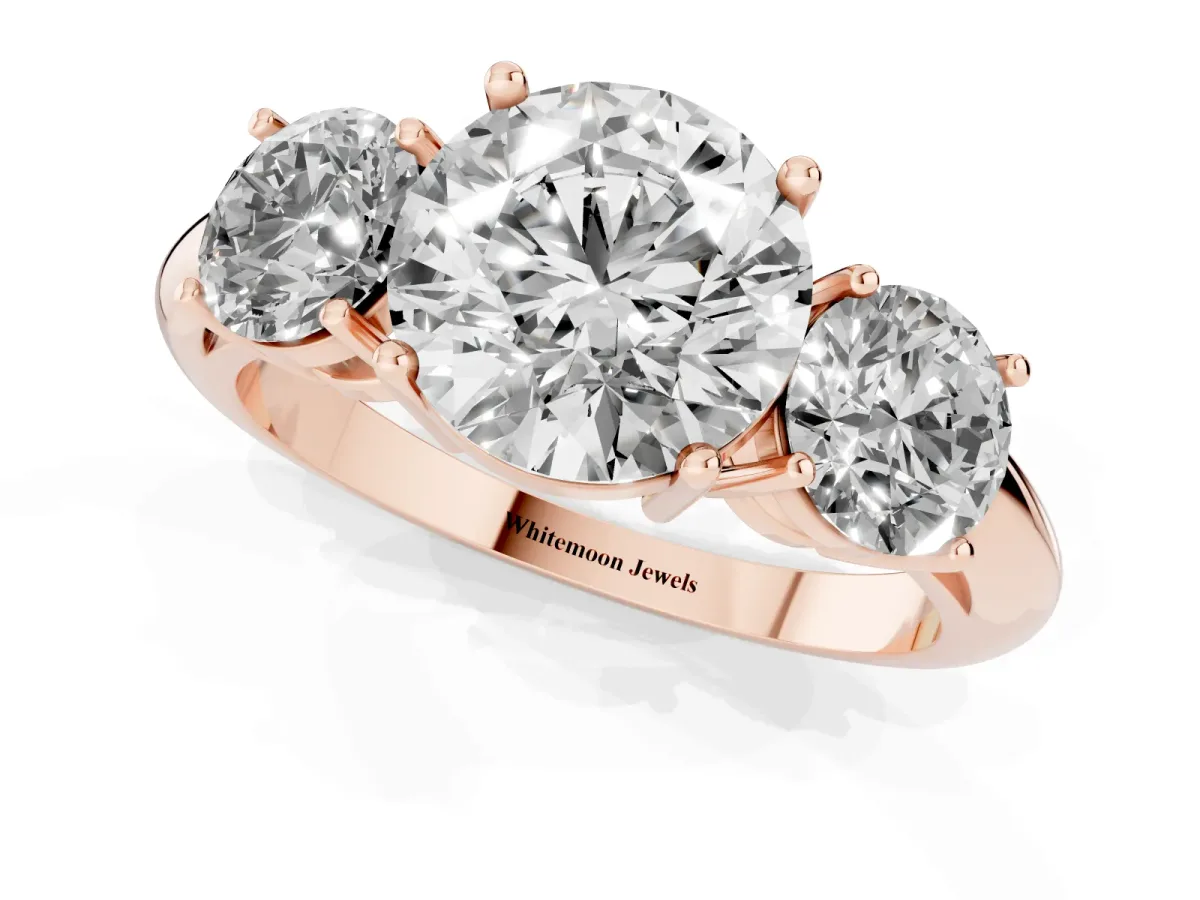 Three-Stone Round Cut Cut Diamond Engagement Ring with Prong Setting on a White Gold Band Rose gold