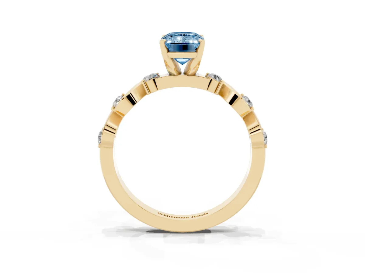 Fancy Blue Emerald Cut Diamond Solitaire Twisted Band with Round Accents and Prong Setting Yellow gold