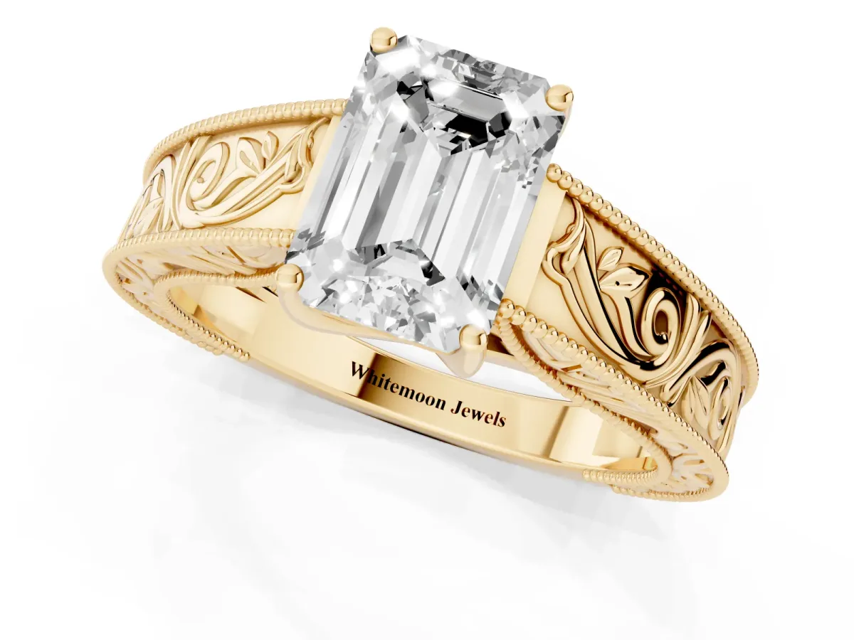 Emerald Cut Diamond Solitaire Ring with Engraved Band and Four-Prong Setting Yellow gold