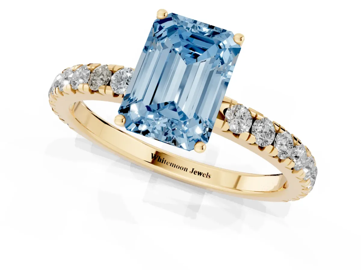 Fancy Blue Emerald Cut Diamond Pavé Solitaire Engagement Ring with Four-Prong Setting Yellow gold