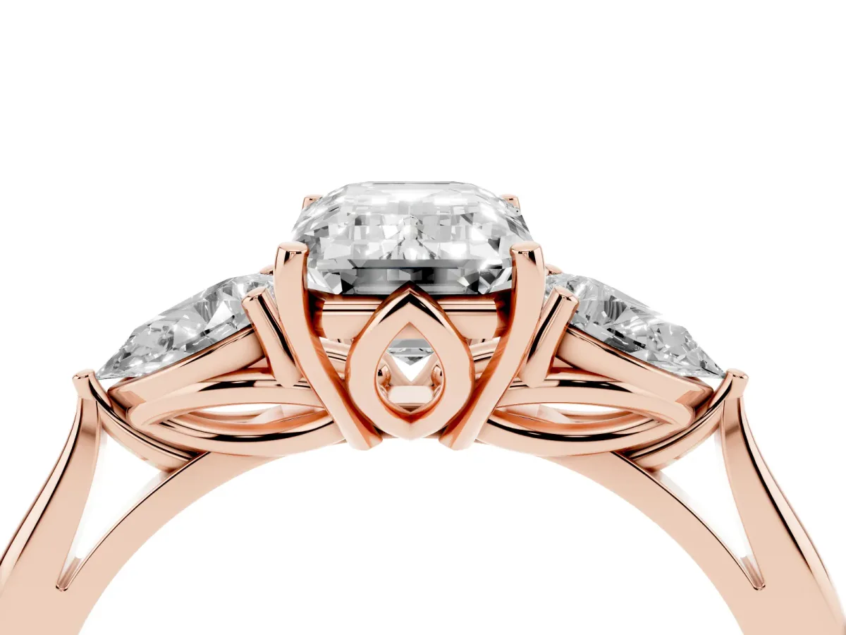 Emerald Cut Diamond Three-Stone Ring with Pear Side Stones and Prong Setting Rose gold