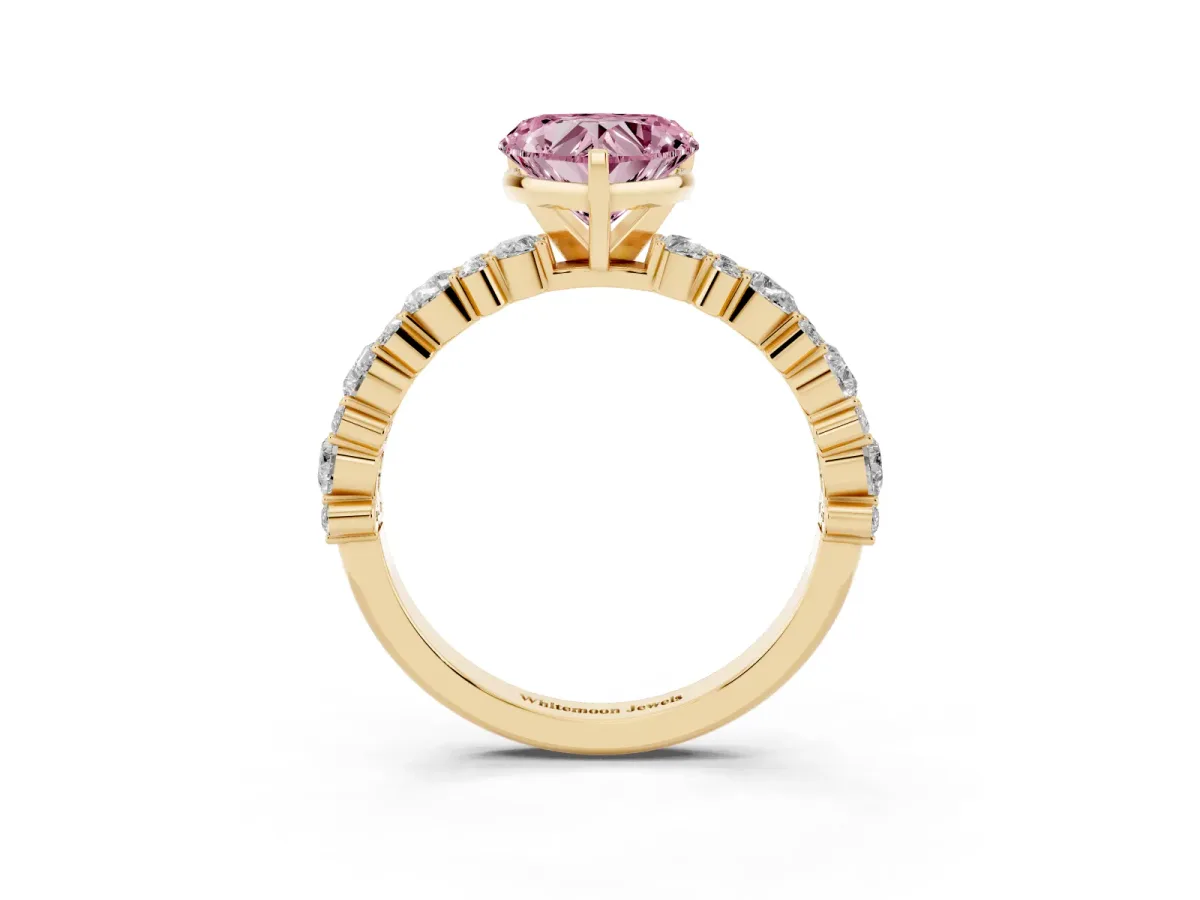 Fancy Pink Heart Cut Diamond Side Stone Solitaire Ring with Round and Four-Prong Setting Yellow gold