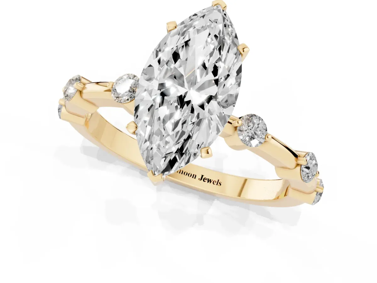 Marquise Cut Solitaire Diamond Ring with Bezel Set Side Stones and Prong Setting Yellow gold