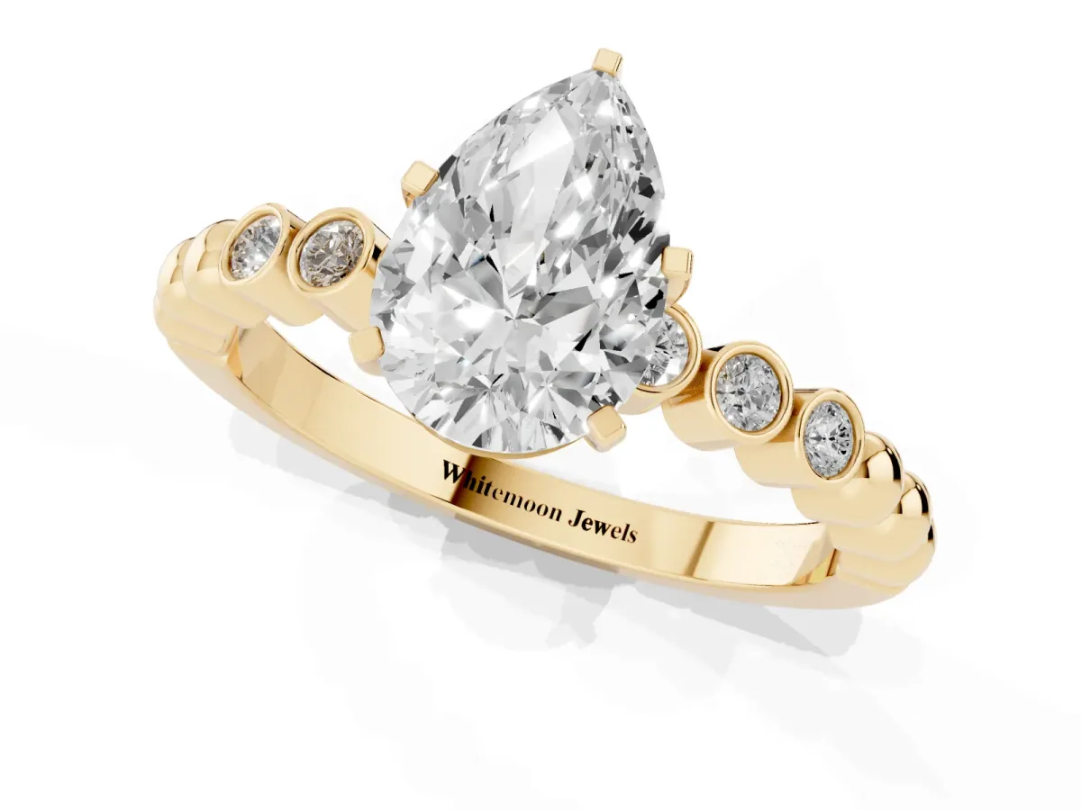 Pear Cut Solitaire Bezel Accent Diamond Engagement Ring with Beaded Band and Four-Prong Setting Yellow gold