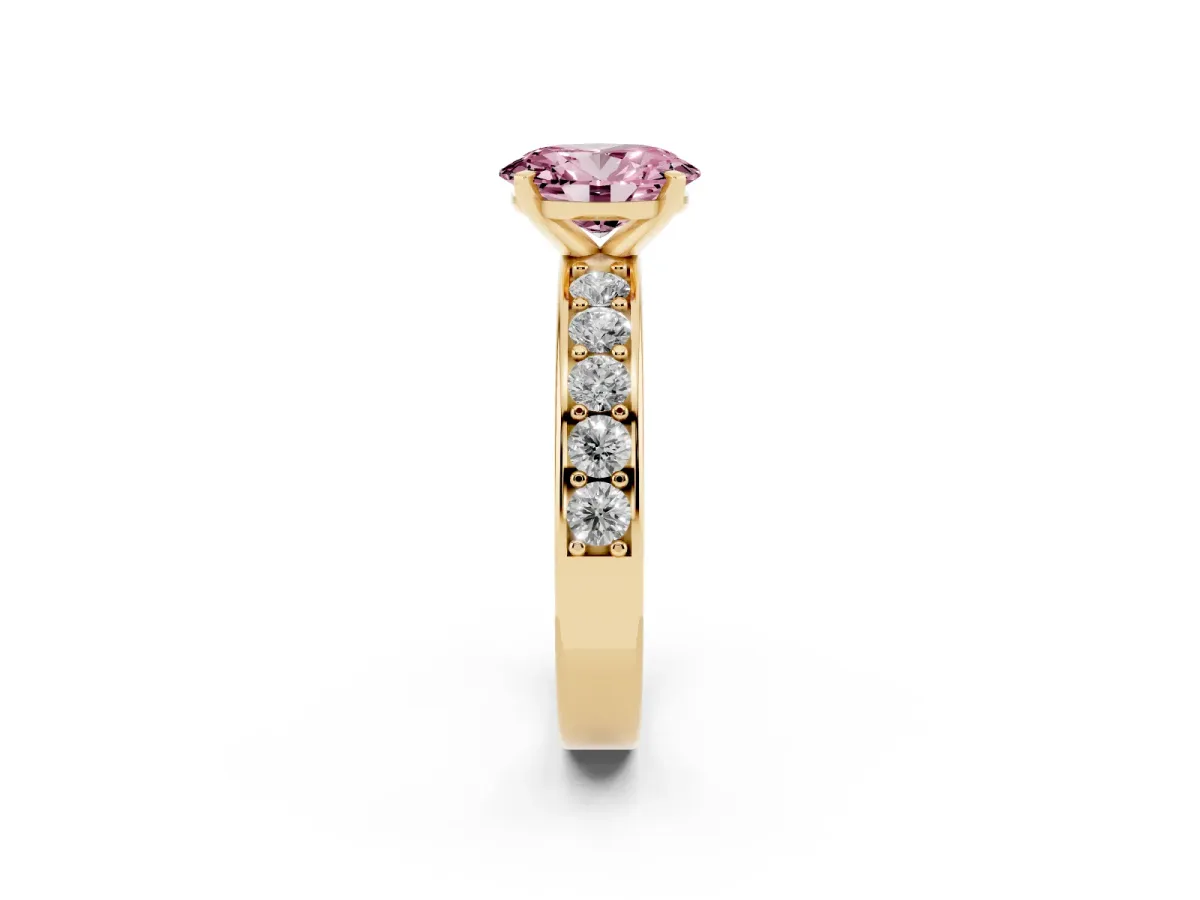 Fancy Pink Oval Cut Diamond Engagement Ring with Channel Set Round Band and Prong Setting Yellow gold