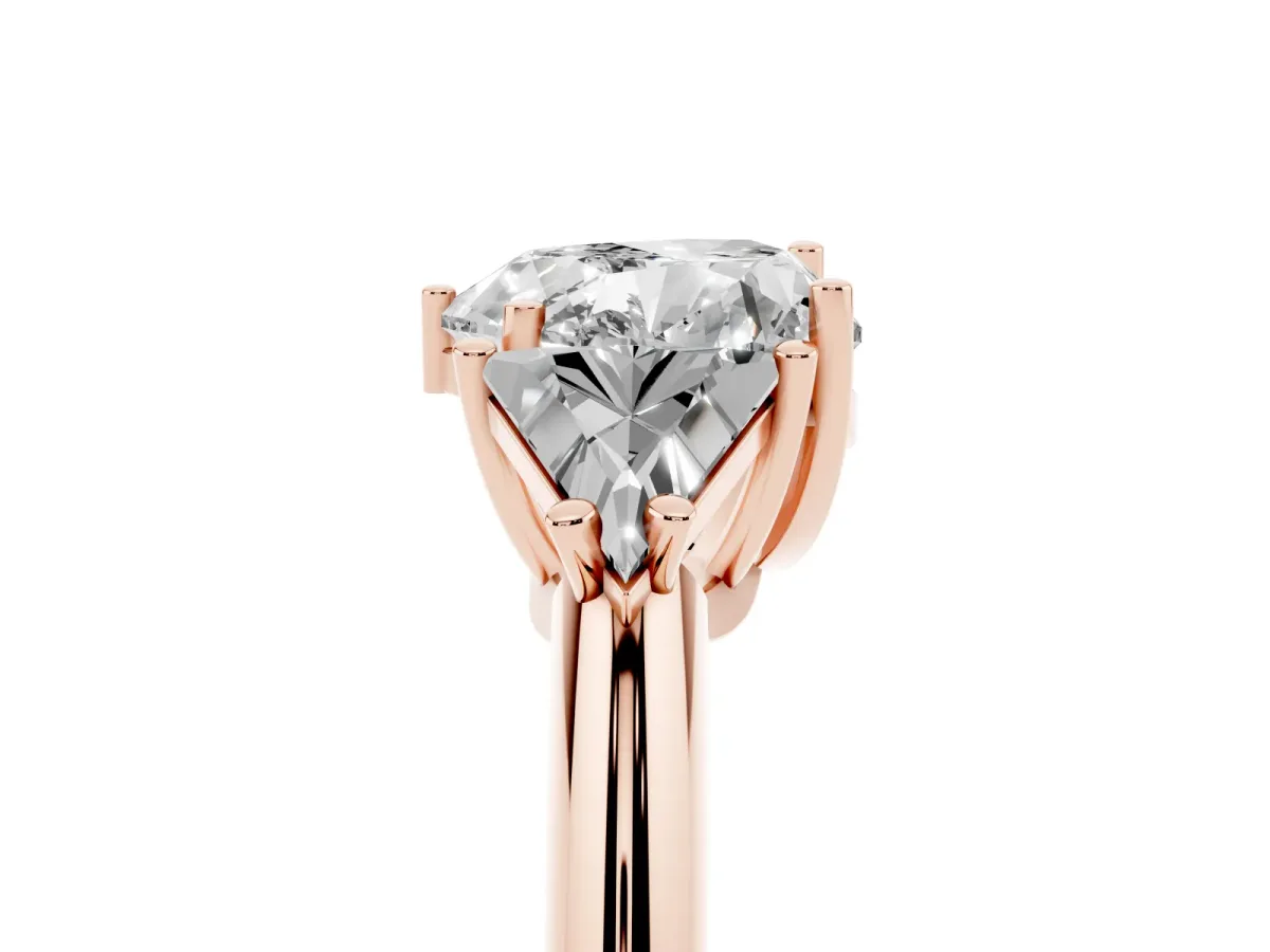 Three-Stone Heart Cut Diamond Engagement Ring with Trillion Side Stones and Prong Setting Rose gold