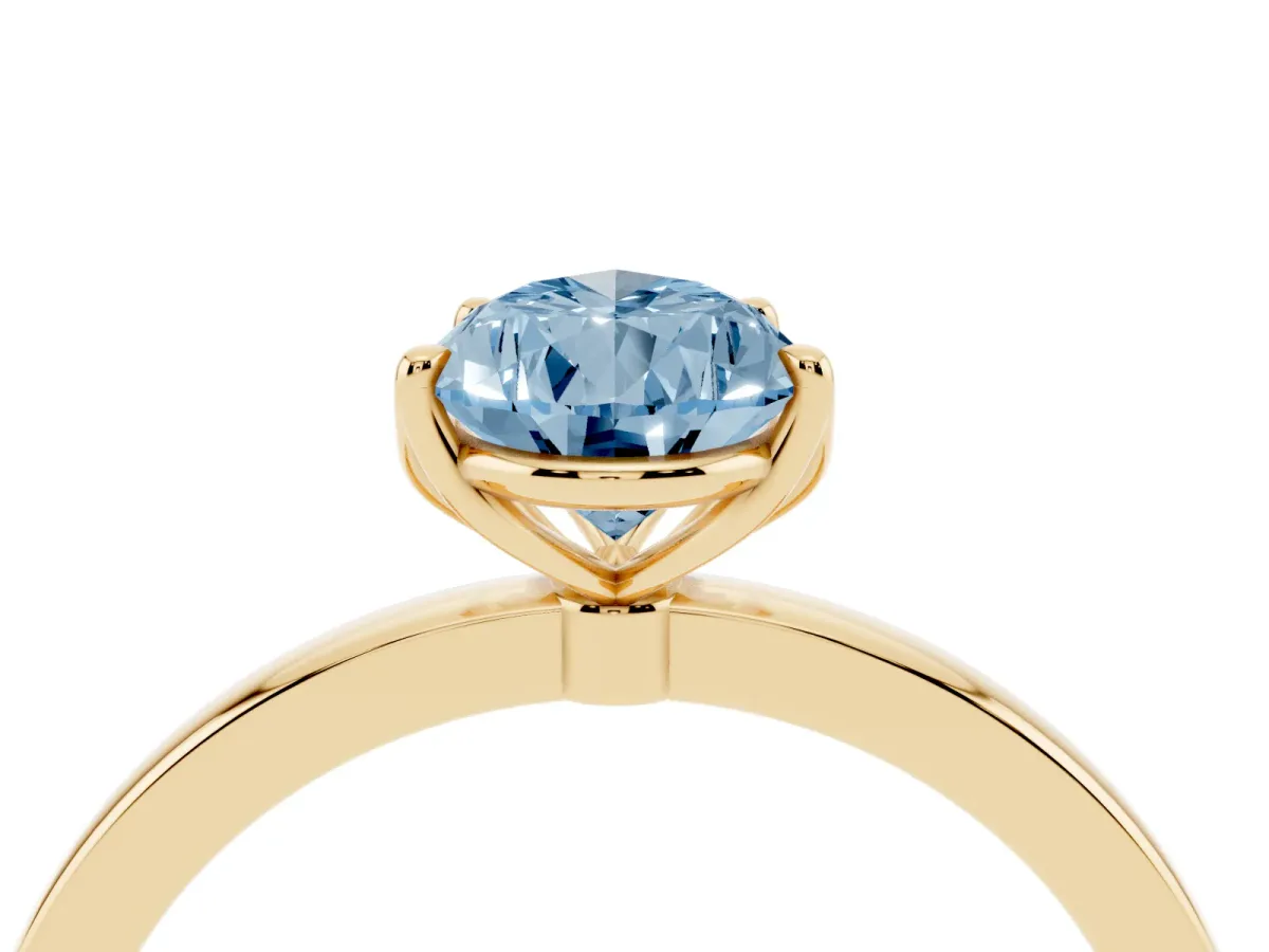 Fancy Blue Pear Cut Diamond Solitaire Ring with Thin Band and Prong Setting Yellow gold