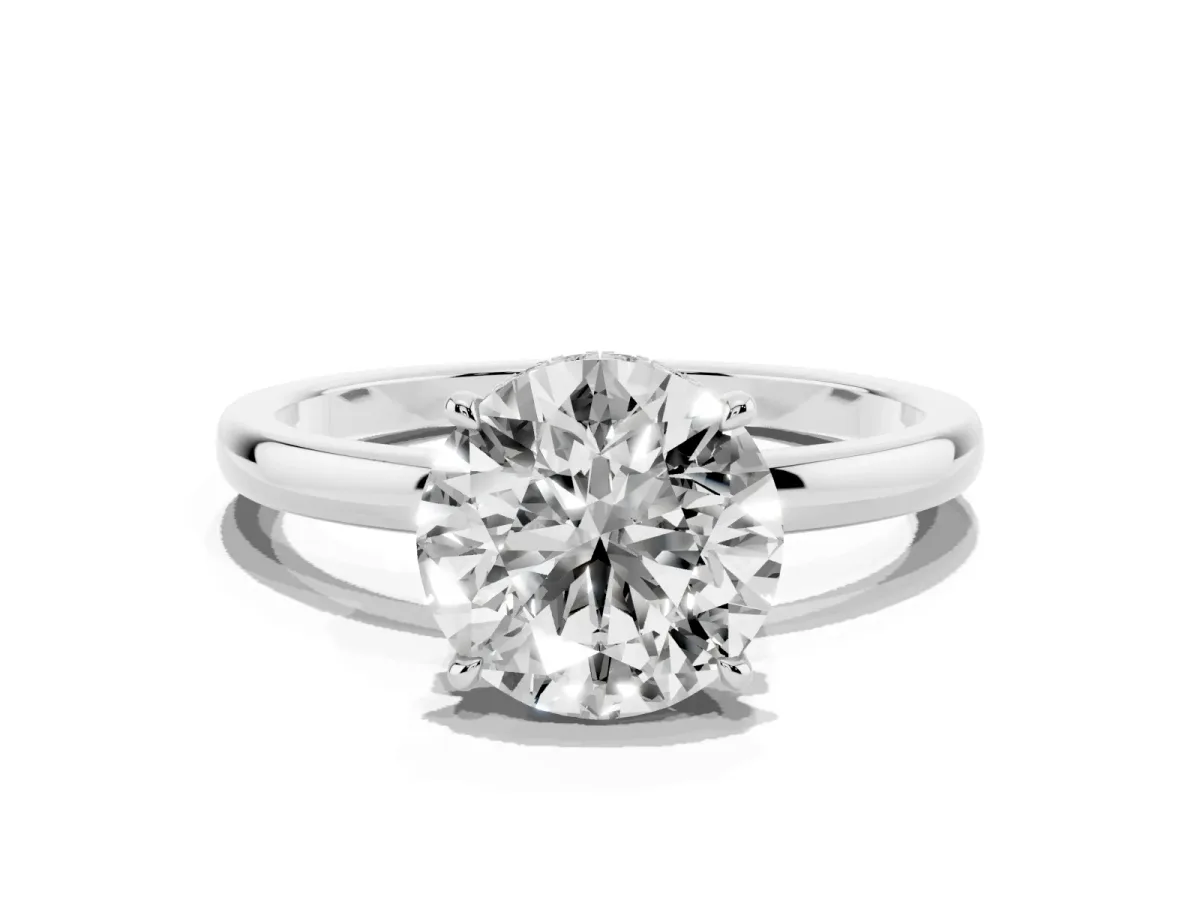 Round Cut Solitaire Engagement Ring with Cathedral Band and Four-Prong Setting Silver