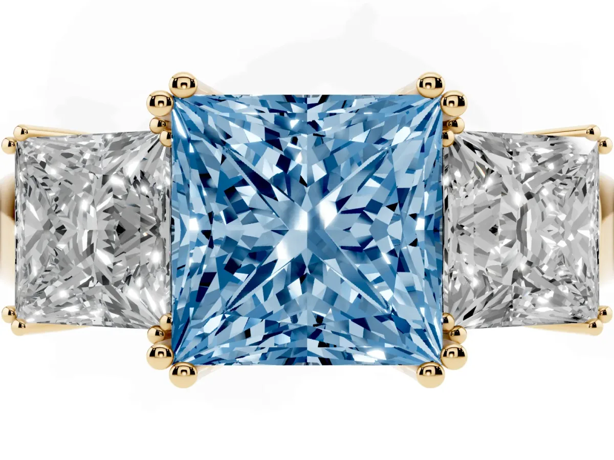 Fancy Blue Three-Stone Princess Cut Cut Diamond Ring with Channel Set Band and Four-Prong Setting Yellow gold
