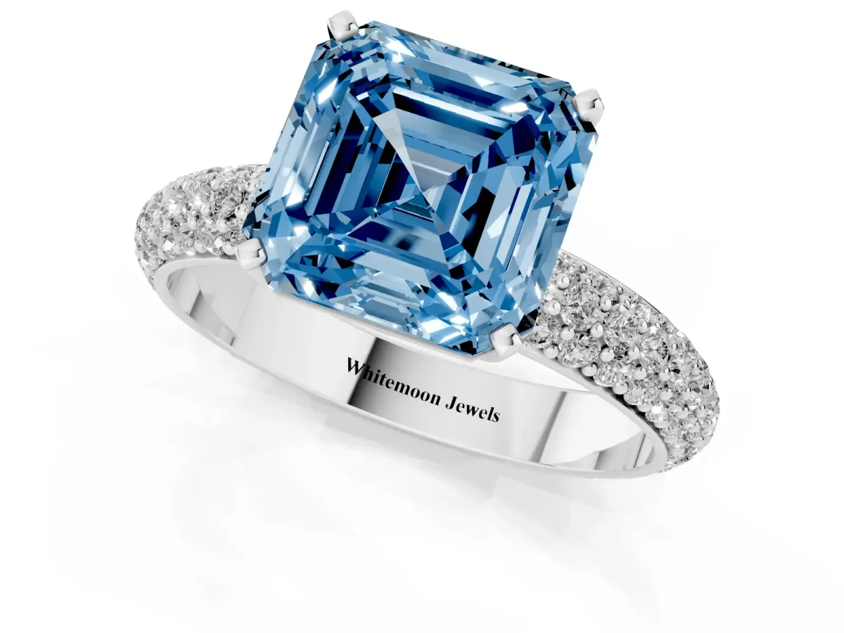 Fancy Blue Asscher Cut Diamond Solitaire Ring with Prong Setting and Pavé Band Platinum