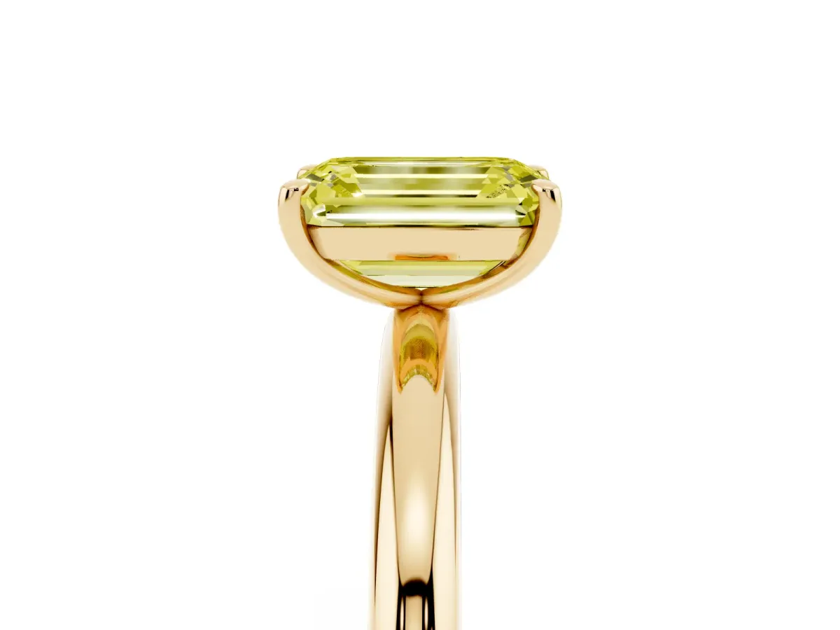 Fancy Yellow Emerald Cut Solitaire Diamond Ring with Four-Prong Setting on a Plain Band Yellow gold