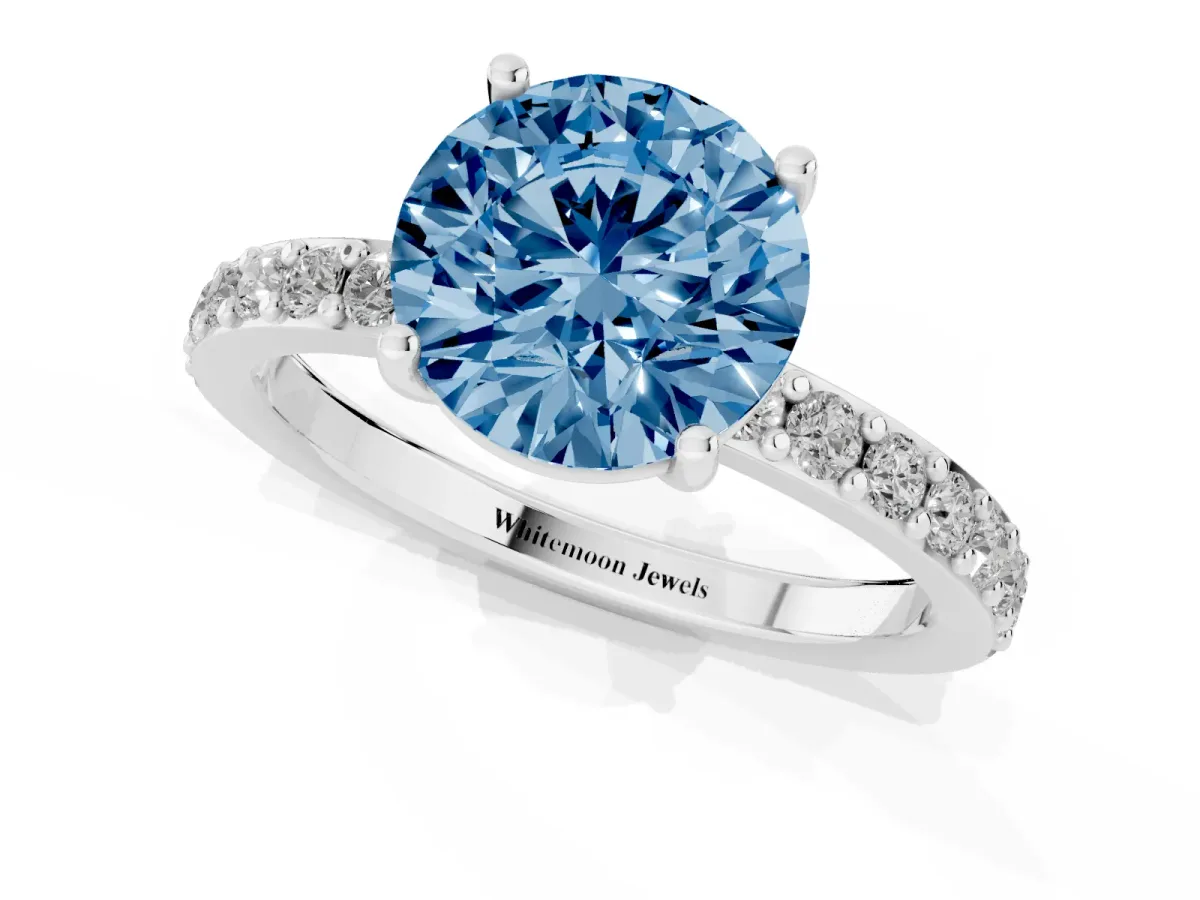 Fancy Blue Round Cut Cut Diamond Solitaire with Pave Band and Four-Prong Setting Silver