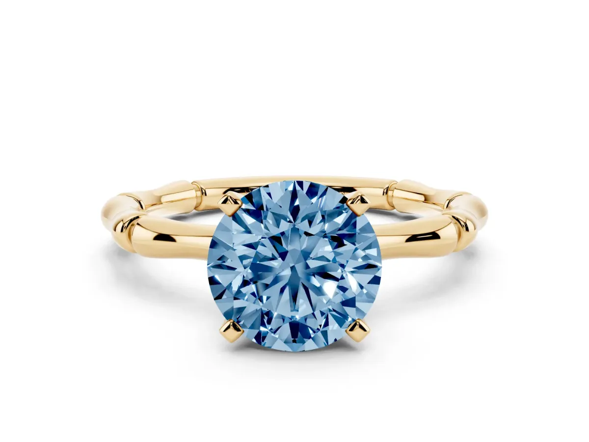 Fancy Blue Round Cut Solitaire Diamond Ring with Bamboo Band and Four-Prong Setting Yellow gold
