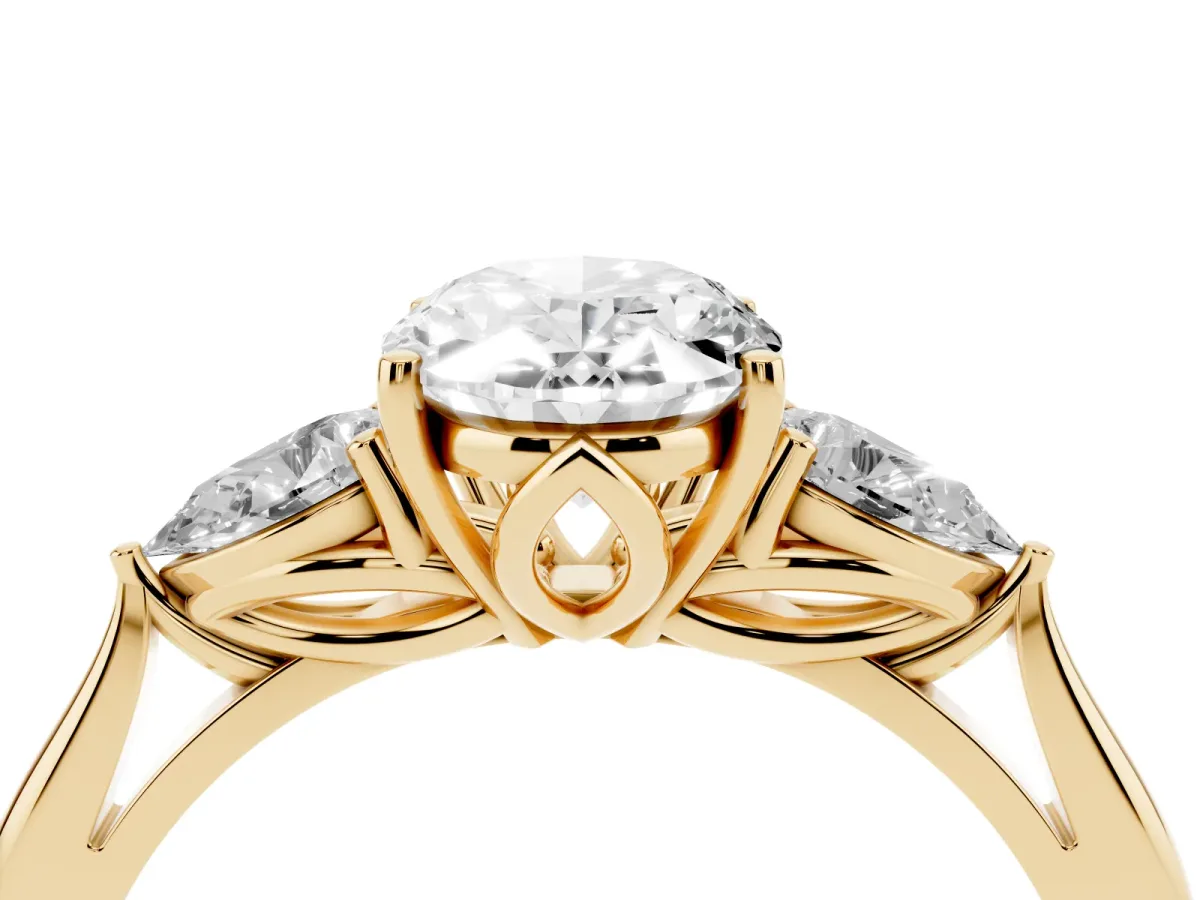 Three-Stone Oval Cut Brilliant Diamond Solitaire Ring with Tapered Band and Four-Prong Setting Yellow gold