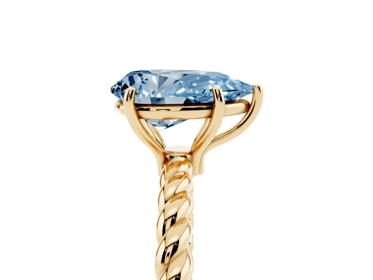 Fancy Blue Pear Cut Solitaire Twist Band Ring with Four-Prong Setting Yellow gold