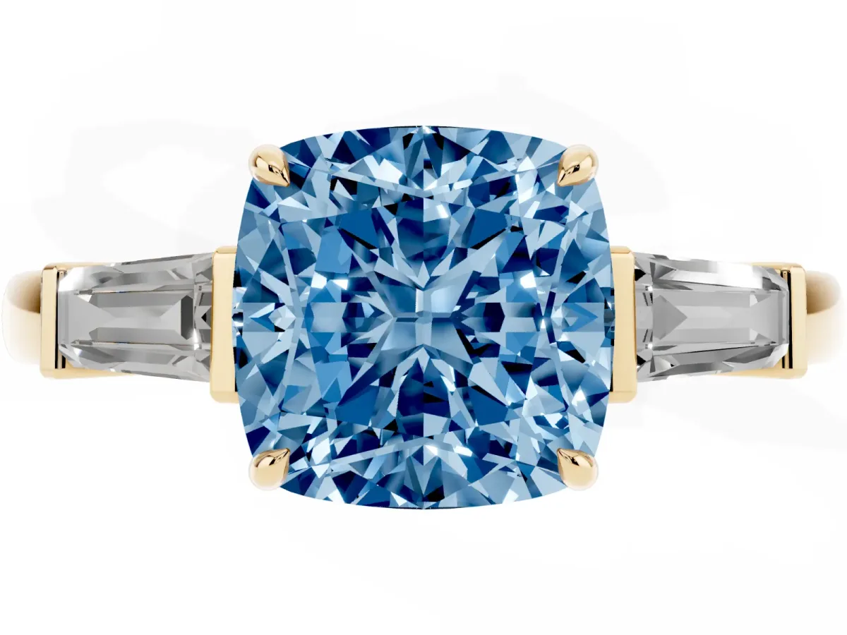 Fancy Blue Cushion Cut Diamond Three-Stone Ring with Tapered Baguette Side Stones and Prong Setting Yellow gold