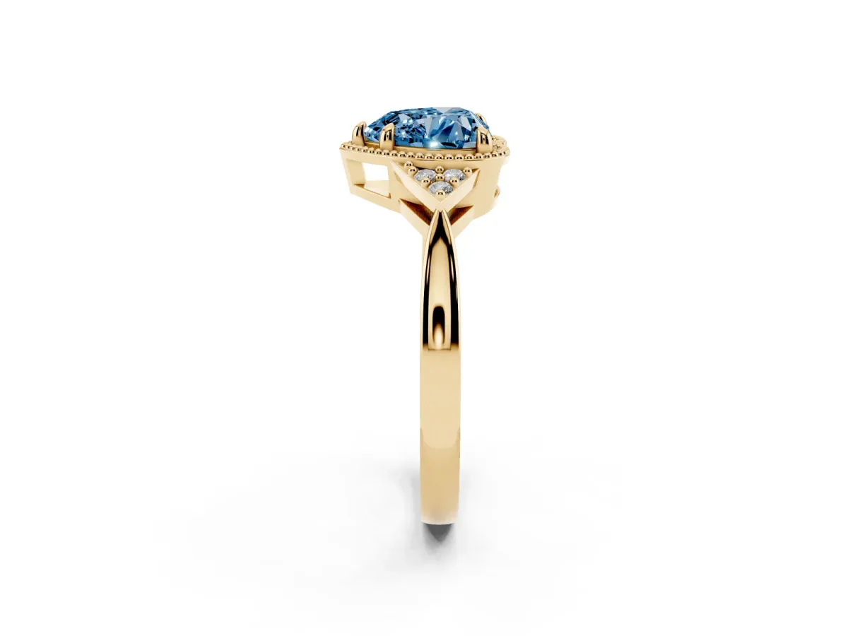 Fancy Blue Milgrain Heart Cut Cut Diamond Ring with Tapered Pave Band and Four Prong Setting Yellow gold