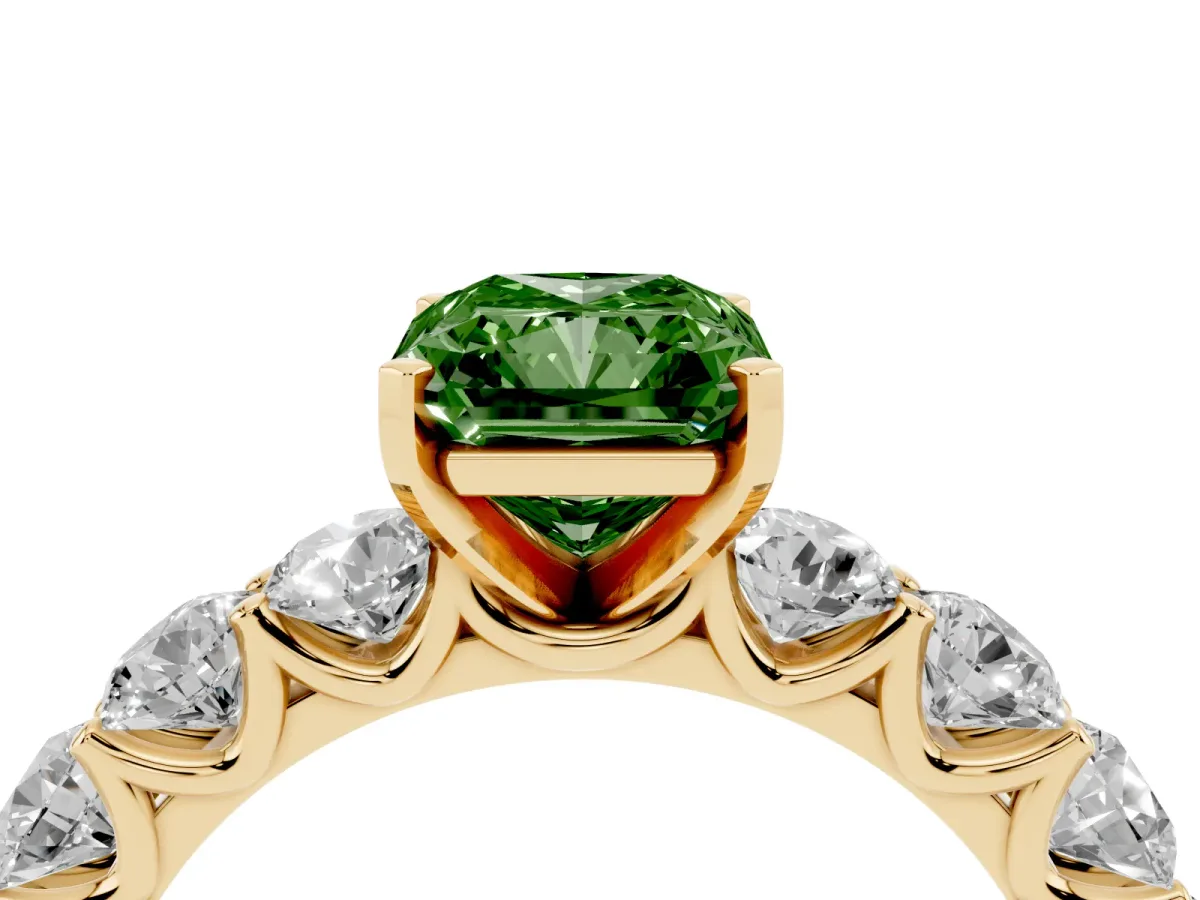 Fancy Green Radiant Cut Diamond Prong Setting with Side Stones on a Pave Band Yellow gold
