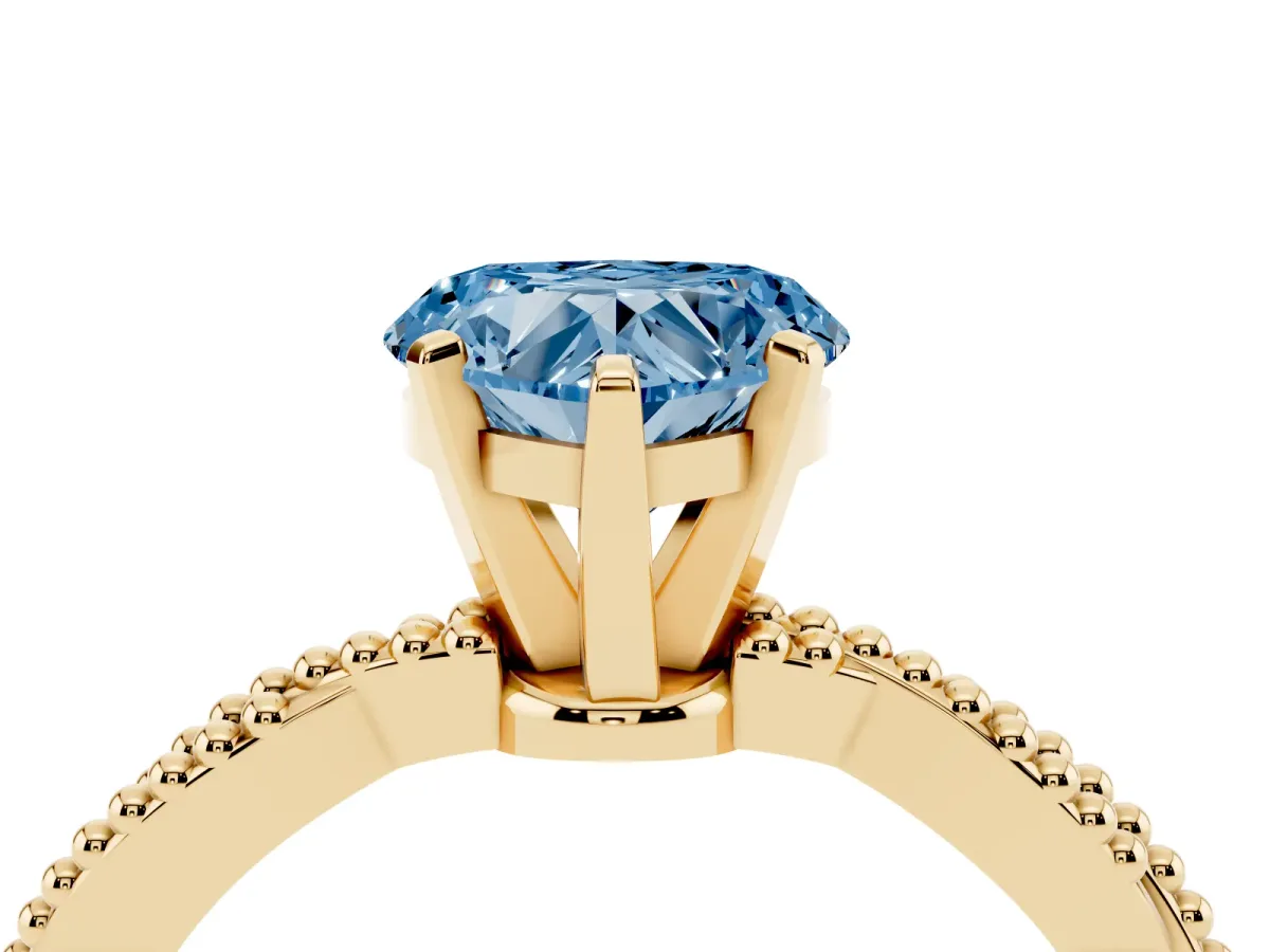 Fancy Blue Heart Cut Solitaire Twisted Band with Bead Prong Setting Yellow gold