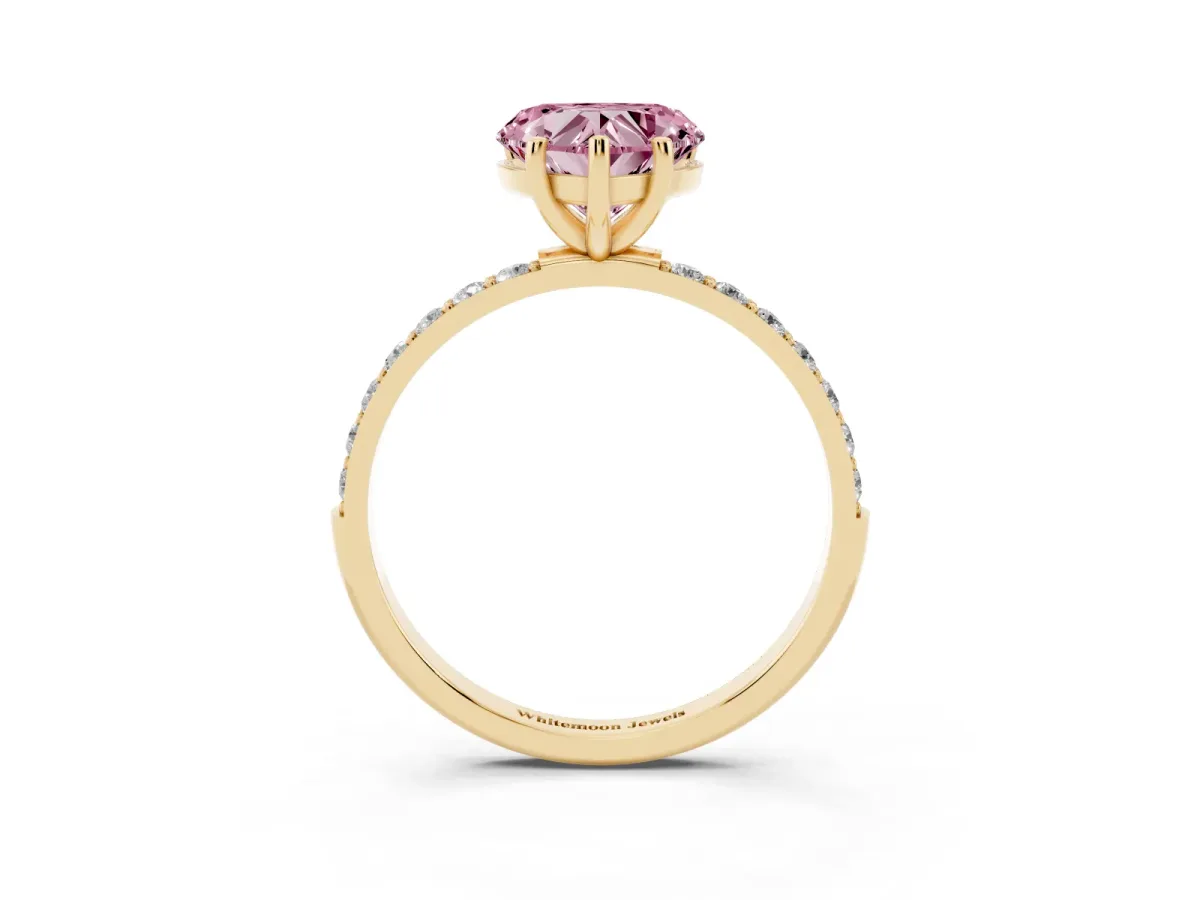 Fancy Pink Heart Cut Diamond Solitaire Ring with Round Pavé Shoulders and Prong Setting Yellow gold