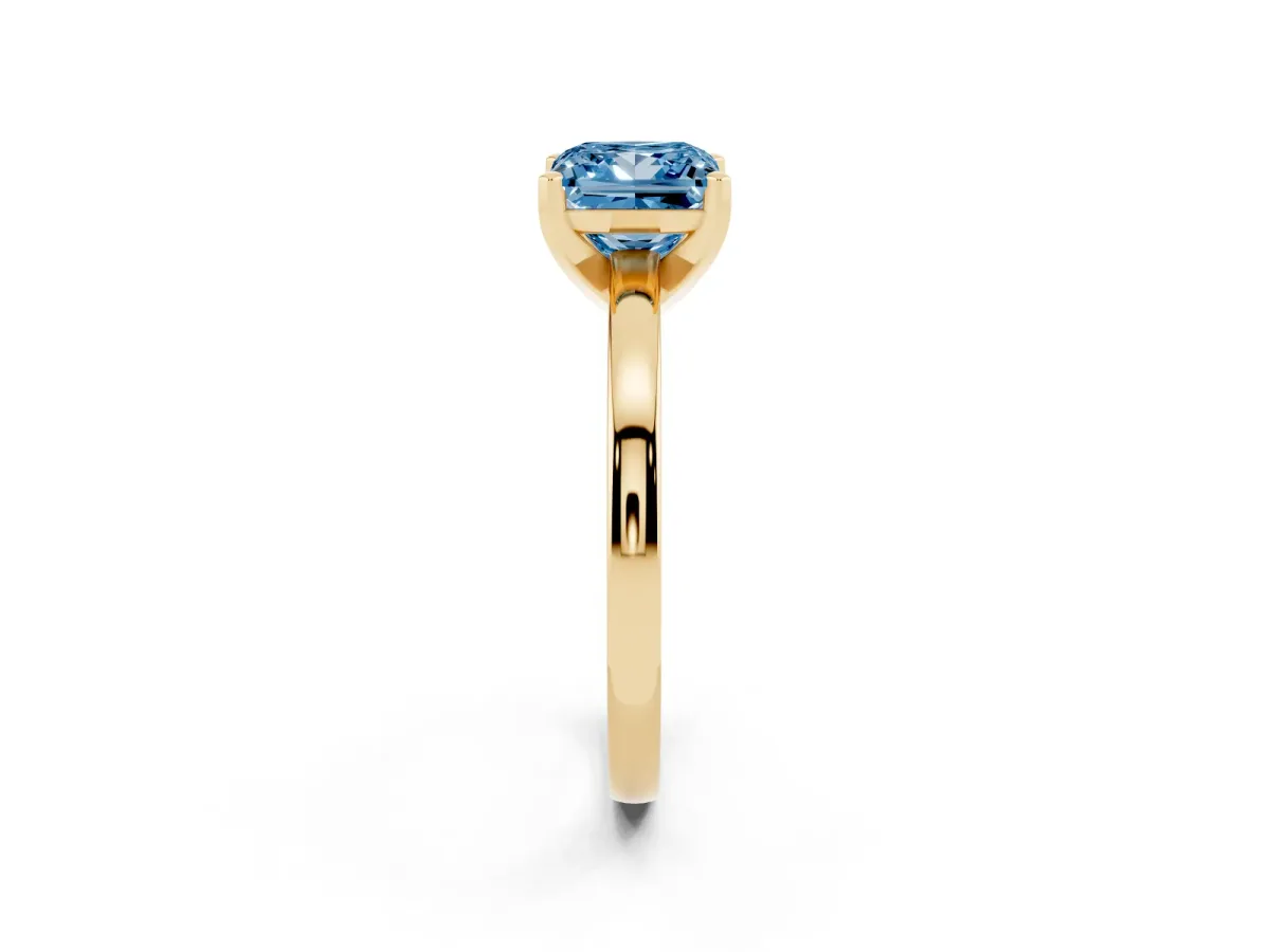 Fancy Blue Princess Cut Solitaire Diamond Engagement Ring with Four-Prong Setting on a Classic Band Yellow gold