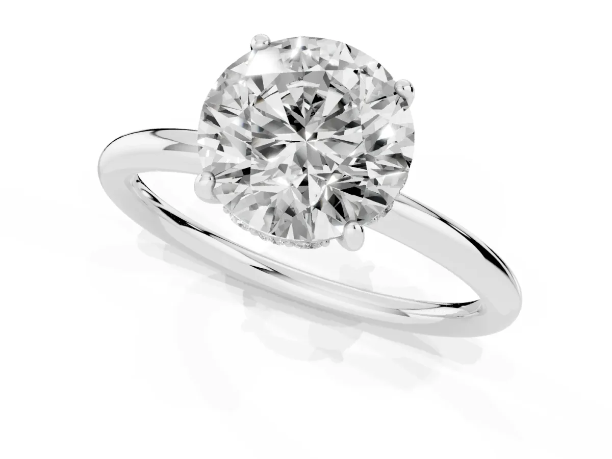 Round Cut Solitaire Diamond Ring with a Classic Band and Four-Prong Setting Platinum