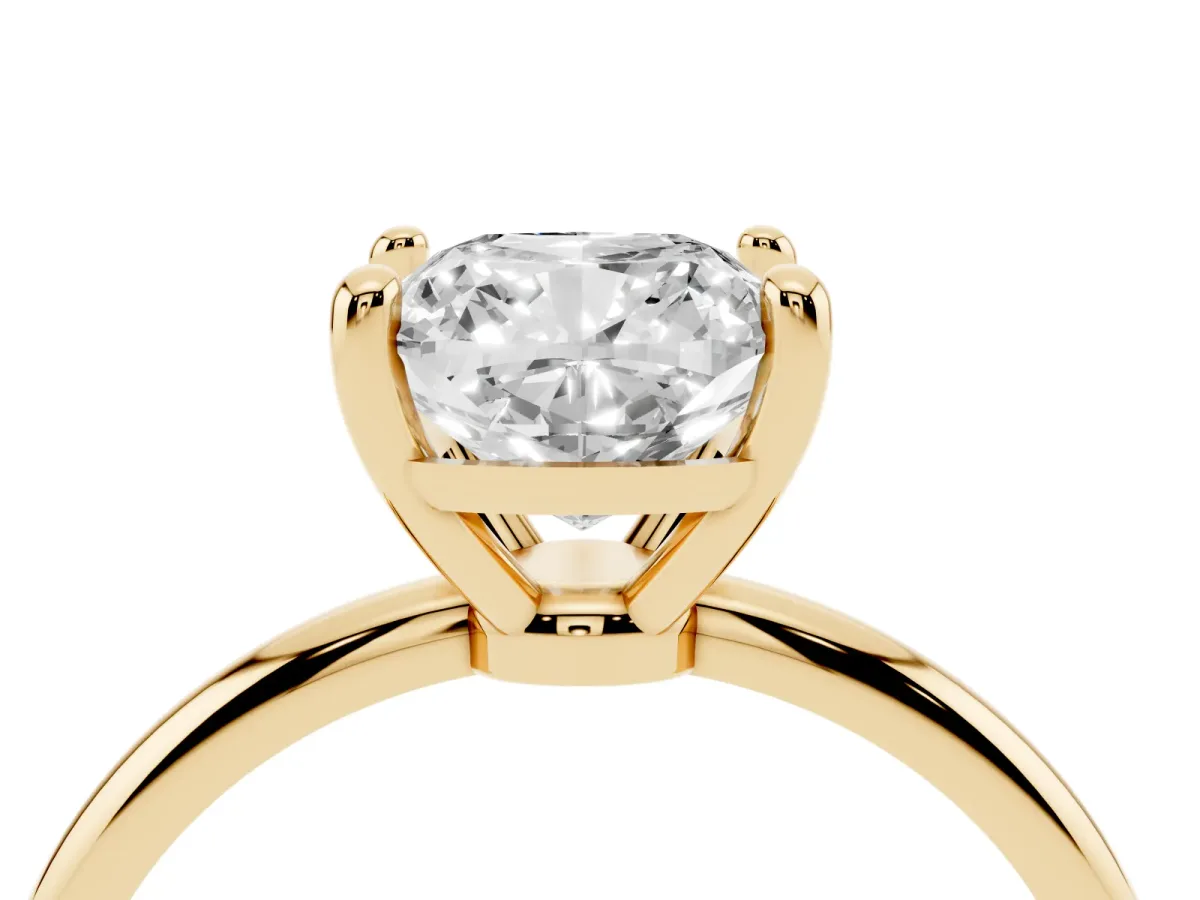 Cushion Cut Solitaire Diamond Ring with 4-Prong Setting on a Classic Band Yellow gold