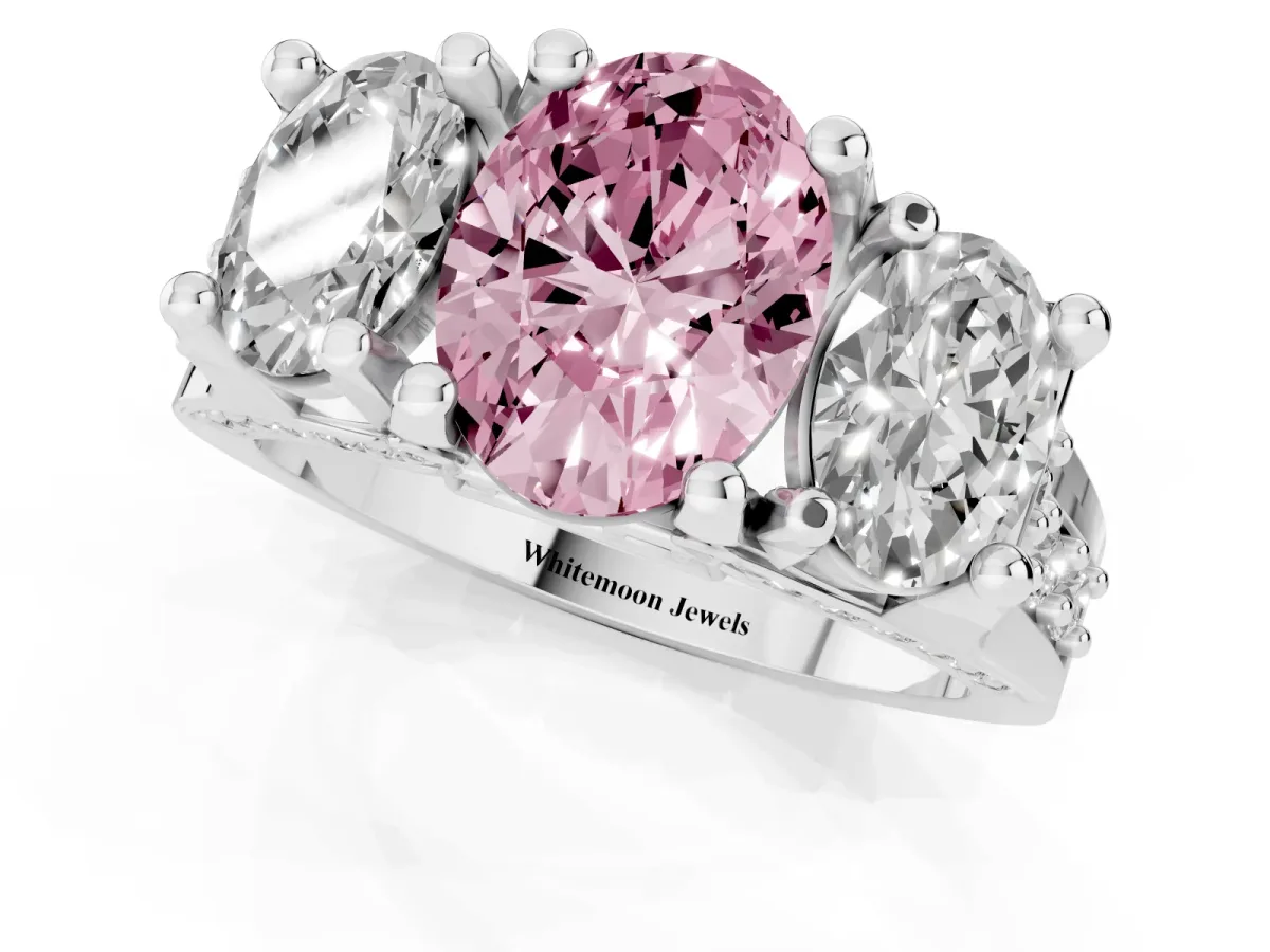 Fancy Pink Oval Cut Diamond Three-Stone Ring with Channel Set Band and Four-Prong Setting Silver