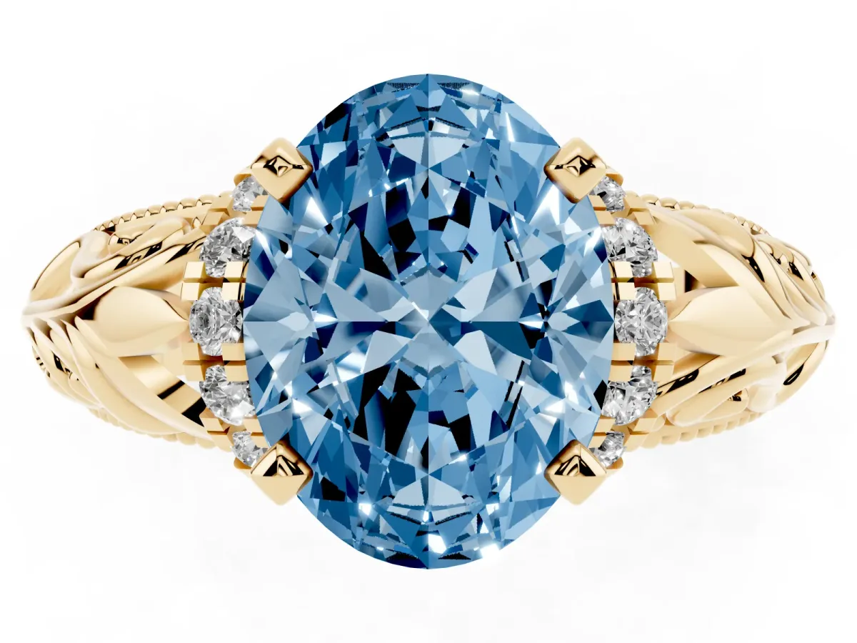 Fancy Blue Oval Cut Solitaire Filigree Engagement Ring with Halo and Prong Setting Yellow gold