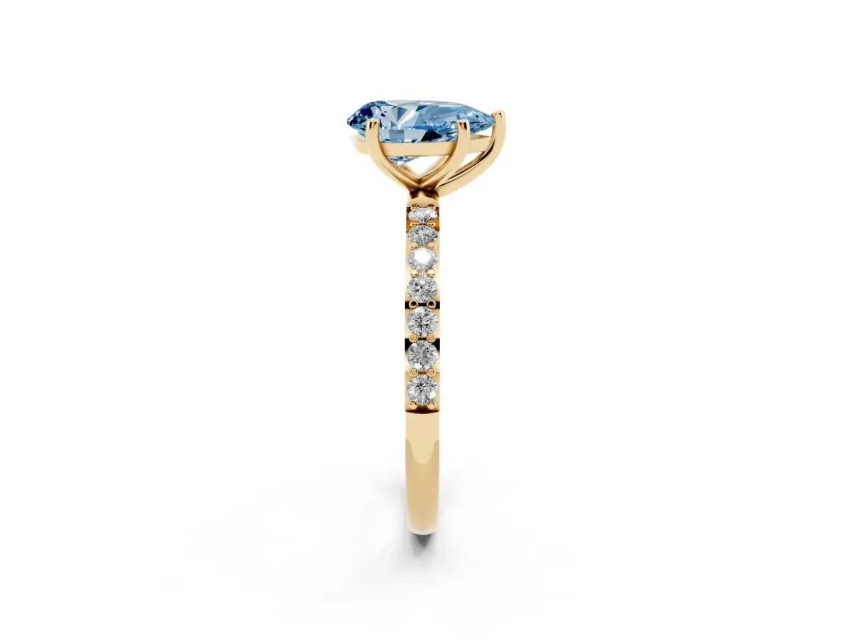 Fancy Blue Pear Cut Diamond Solitaire Ring with Round Pavé Shoulders and Prong Setting Yellow gold