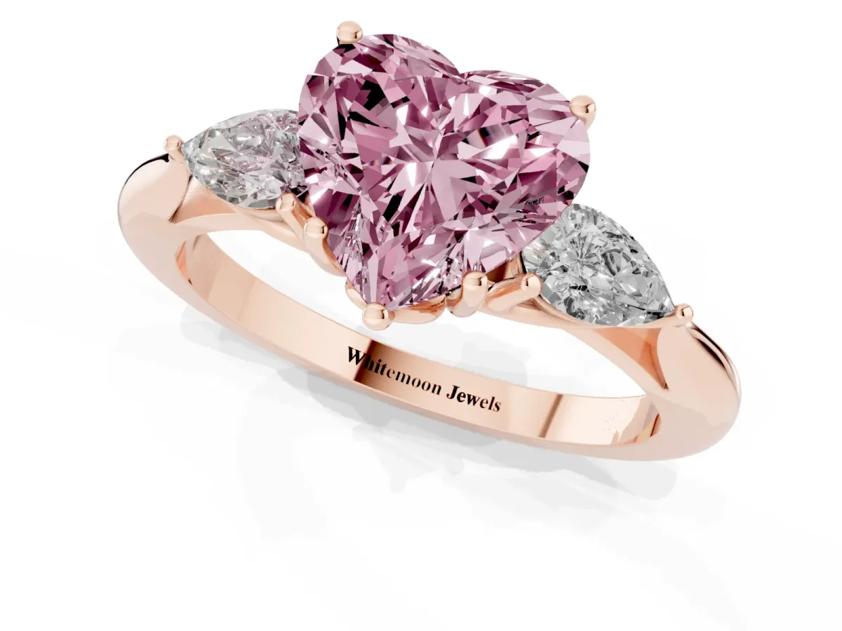 Fancy Pink Three-Stone Heart Cut Brilliant Diamond Solitaire Ring with Tapered Band and Four-Prong Setting Rose gold