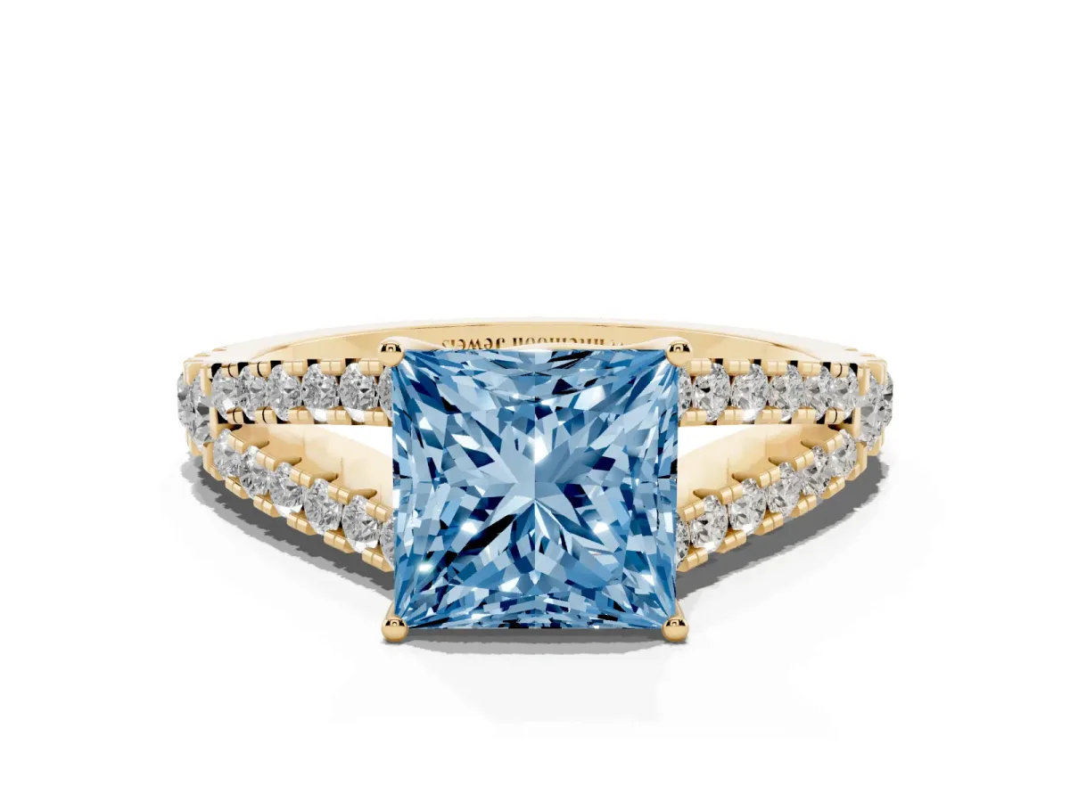 Fancy Blue Princess Cut Diamond Split Shank Pavé Engagement Ring with Four-Prong Setting Yellow gold