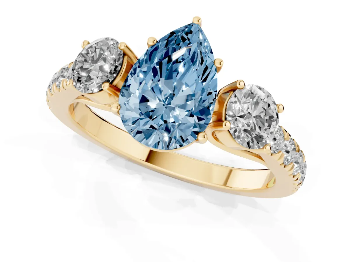 Fancy Blue Pear Cut Cut Diamond Three-Stone Ring with Round Side Stones and Pavé Band Yellow gold